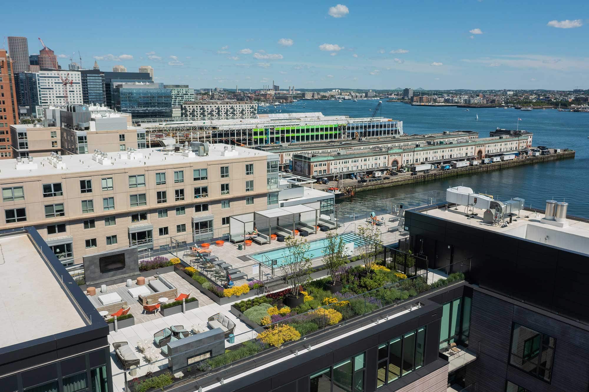 Ora Seaport Boston rooftop terrace waterside - luxury rental apartment amenities