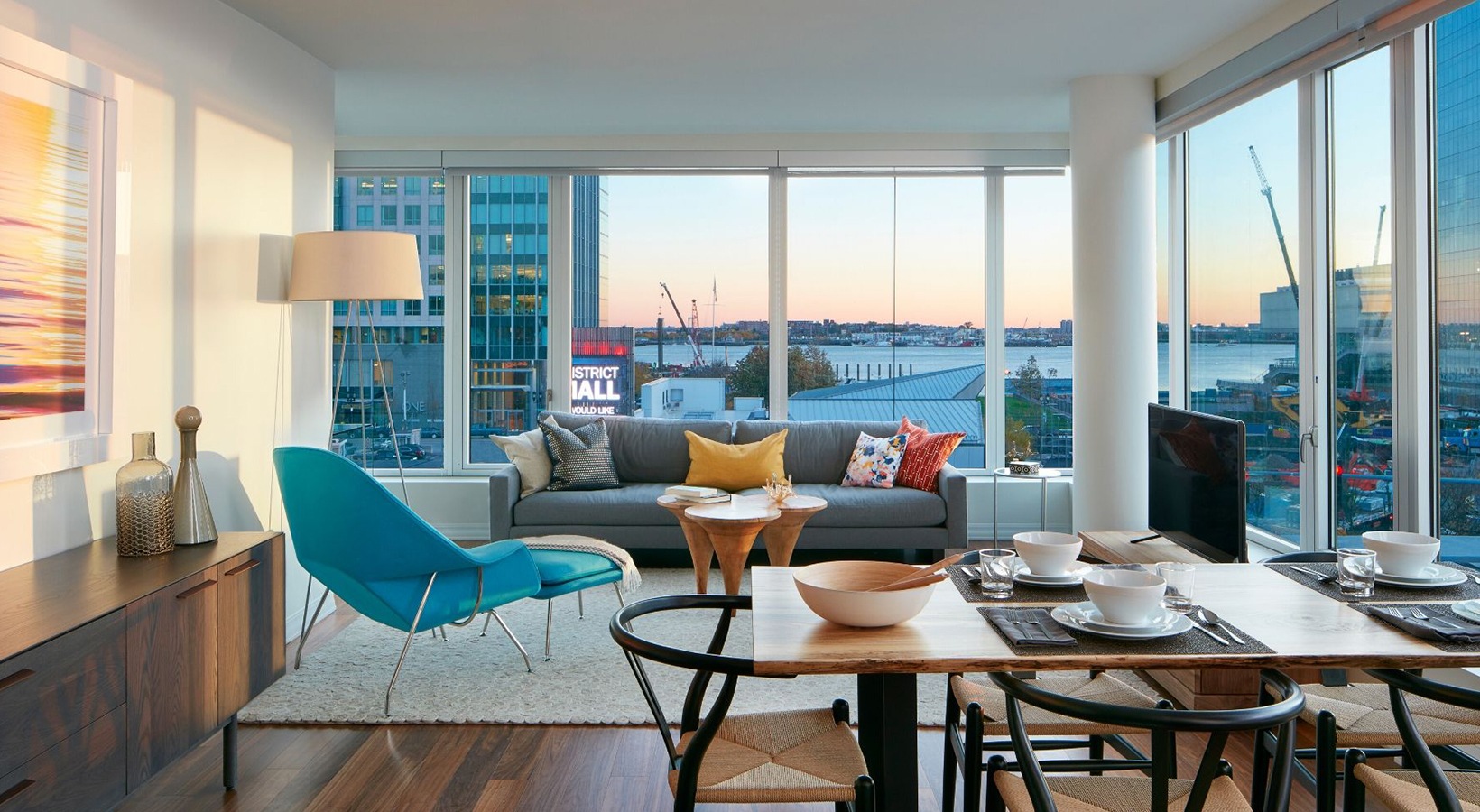 Watermark Seaport Boston luxury apartment - Living Room with Harbor Sunset Views